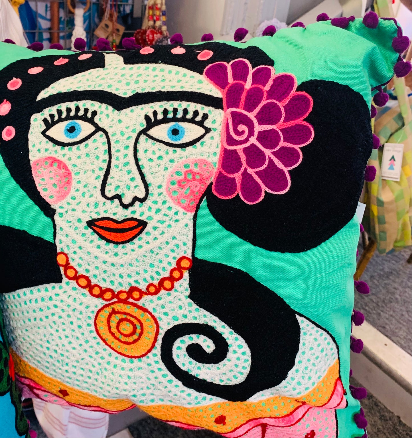 Beautiful handmade frida Kahlo design multicoloured embroidered cushion with Pom Pom trim