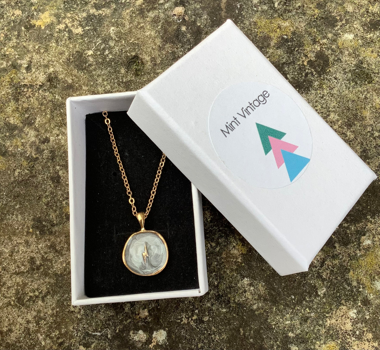 Grey gold tone enamel necklace