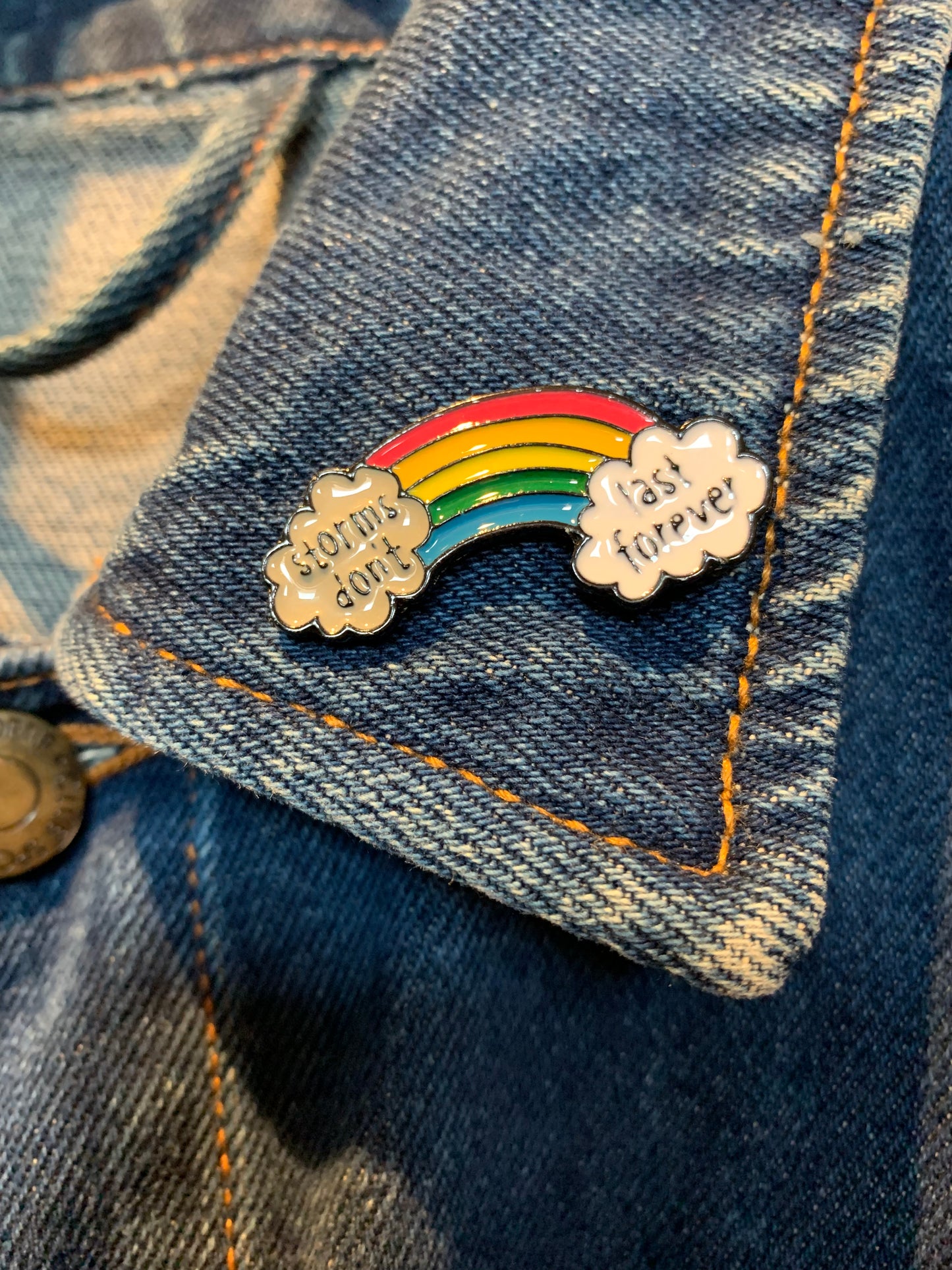 Rainbow “storms don’t last forever” pin badge