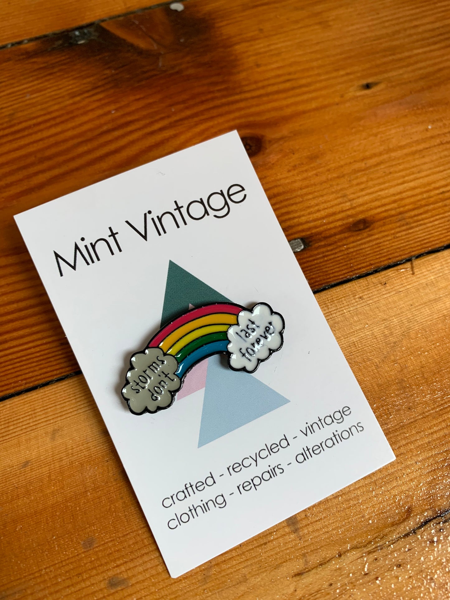 Rainbow “storms don’t last forever” pin badge