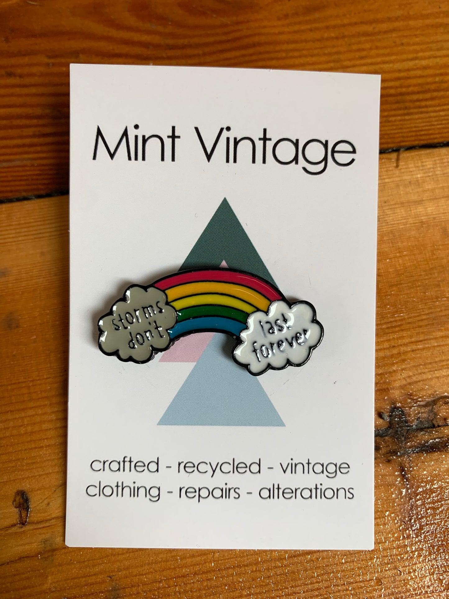 Rainbow “storms don’t last forever” pin badge