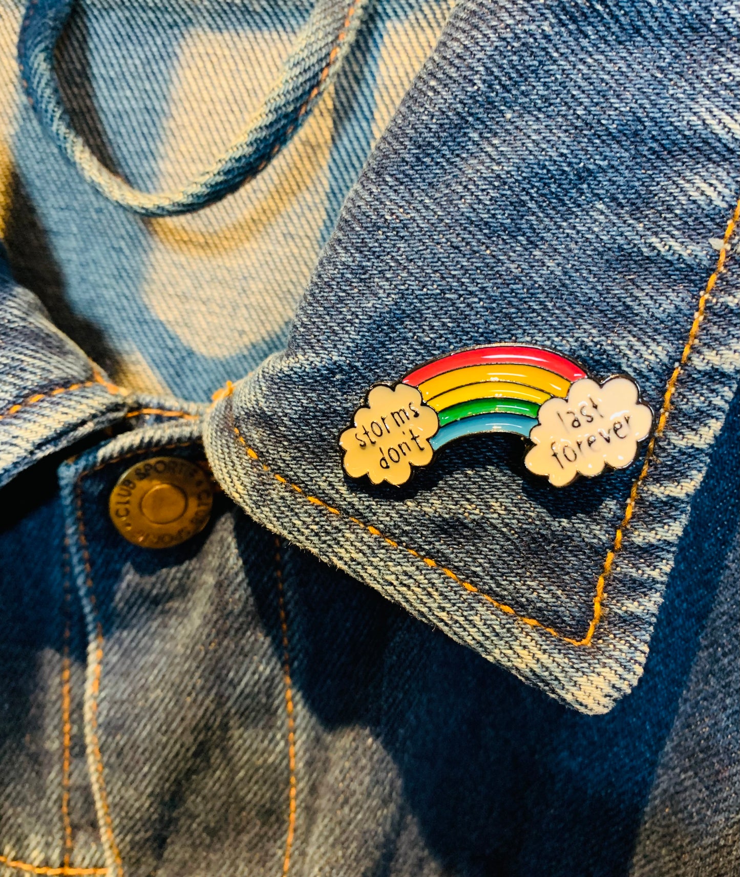 Rainbow “storms don’t last forever” pin badge