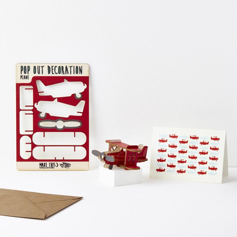 Pop out greeting card featuring bright red biplane